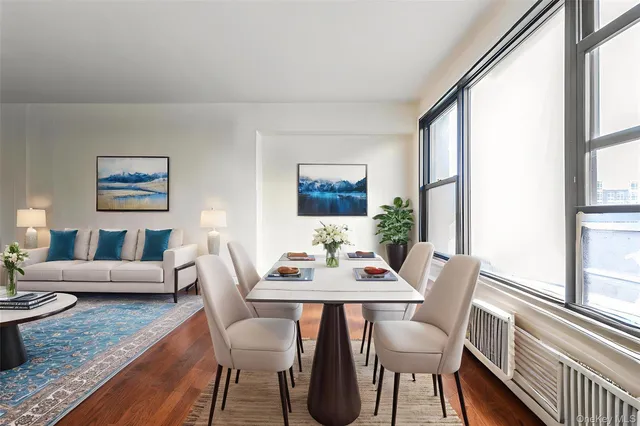 a view of a dining room with furniture window and wooden floor