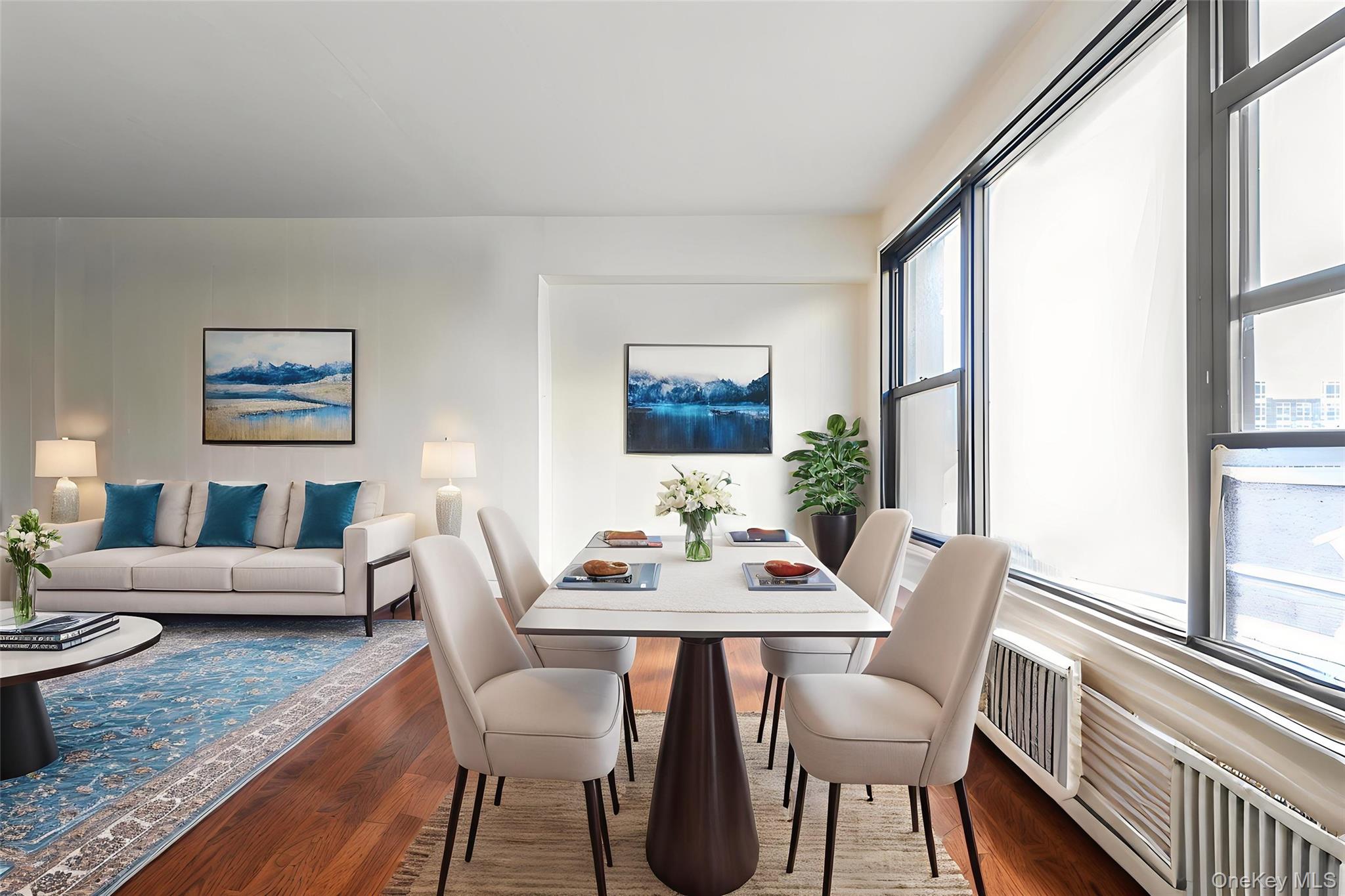 a view of a dining room with furniture window and wooden floor
