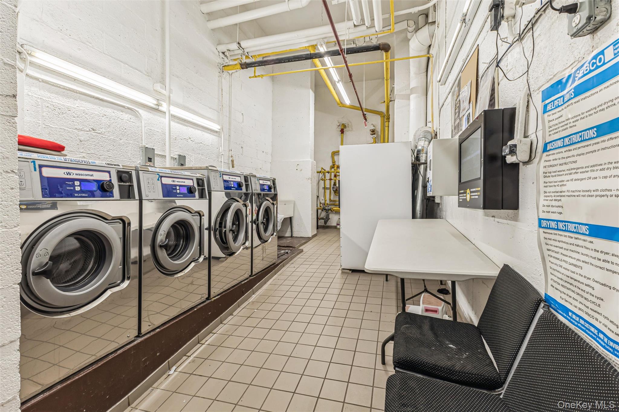 98-19 64th Avenue, Unit 3D Queens, NY 11374 - Photo 13 of 13 a utility room with dryer and washer