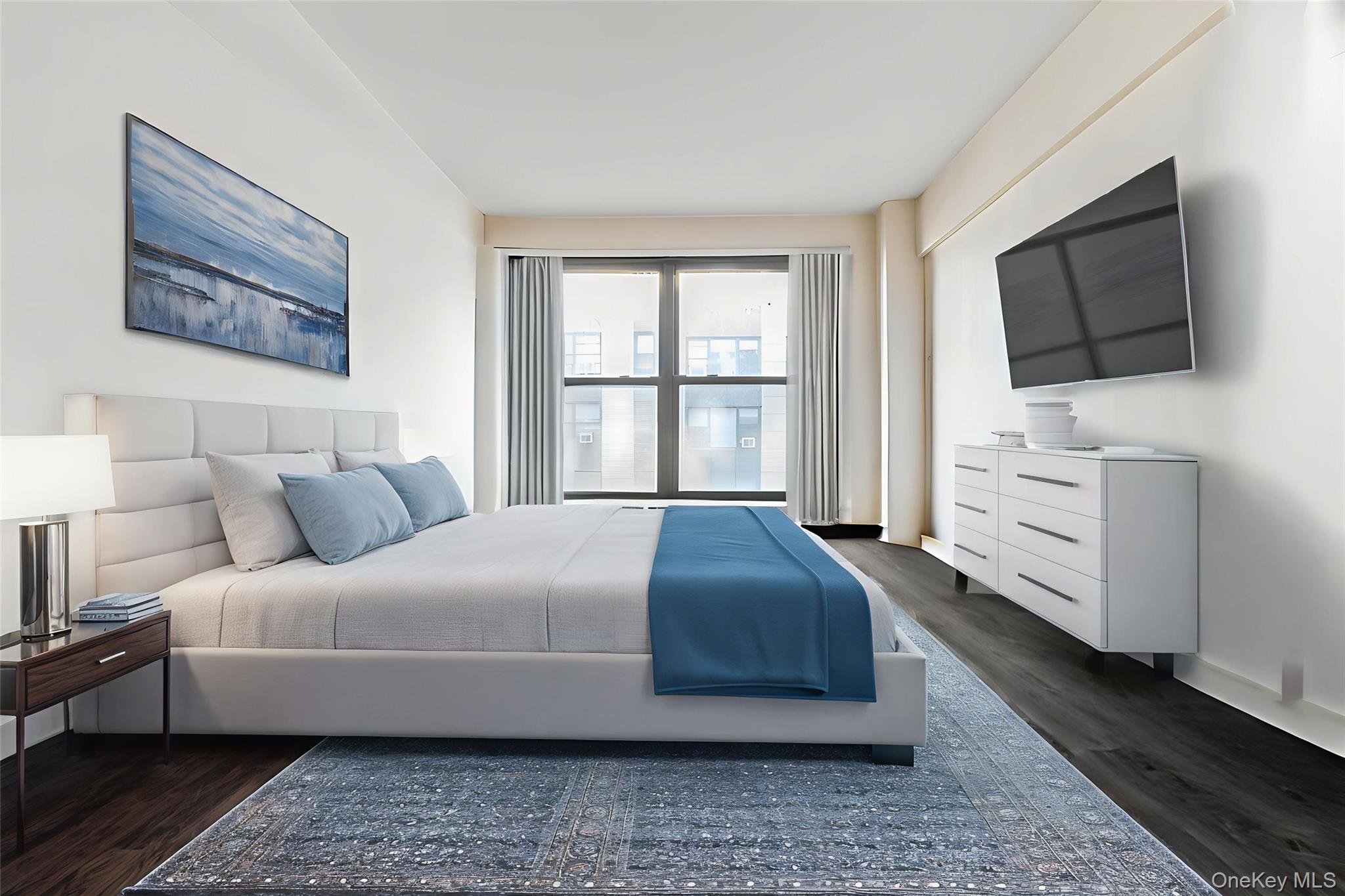 98-19 64th Avenue, Unit 3D Queens, NY 11374 - Photo 5 of 13 a bedroom with a bed and flat screen tv