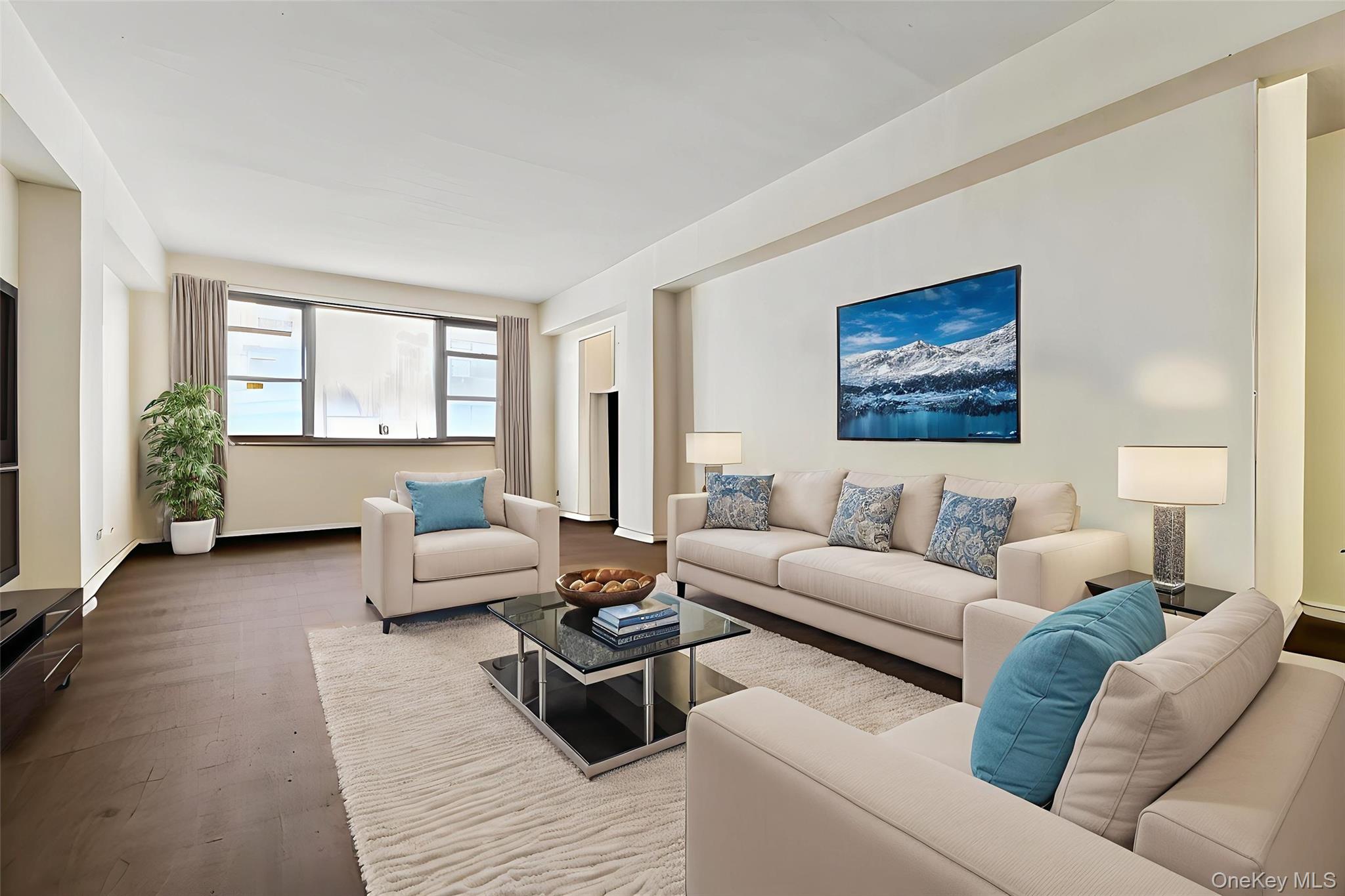 98-19 64th Avenue, Unit 3D Queens, NY 11374 - Photo 7 of 13 a living room with furniture and a couch