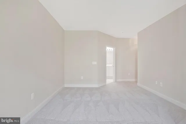 a bedroom with a bed and flat screen tv