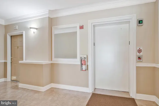 a view of a brick house with plants