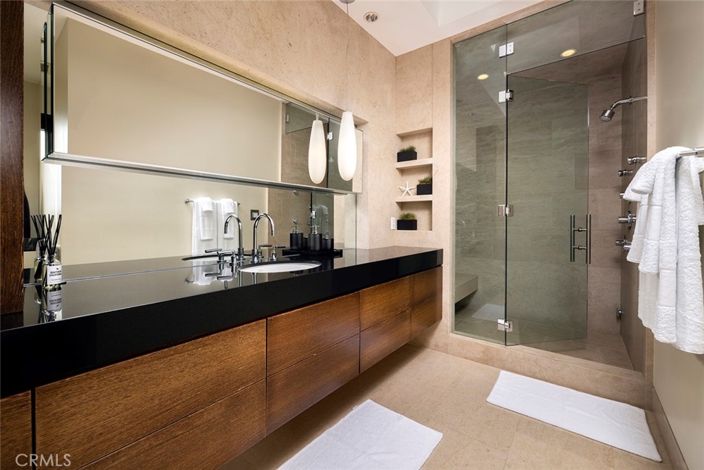 9 Sailcrest Newport Coast, CA 92657 - Photo 21 of 37 a kitchen with kitchen island a sink and a counter top space