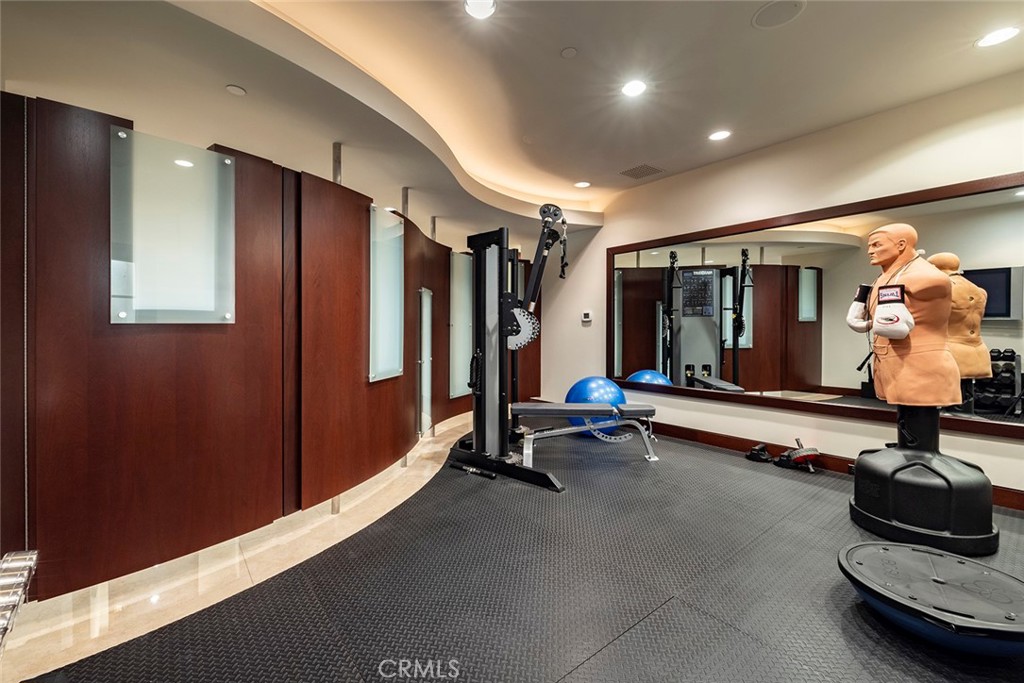 9 Sailcrest Newport Coast, CA 92657 - Photo 27 of 37 a room with gym equipment and a large window