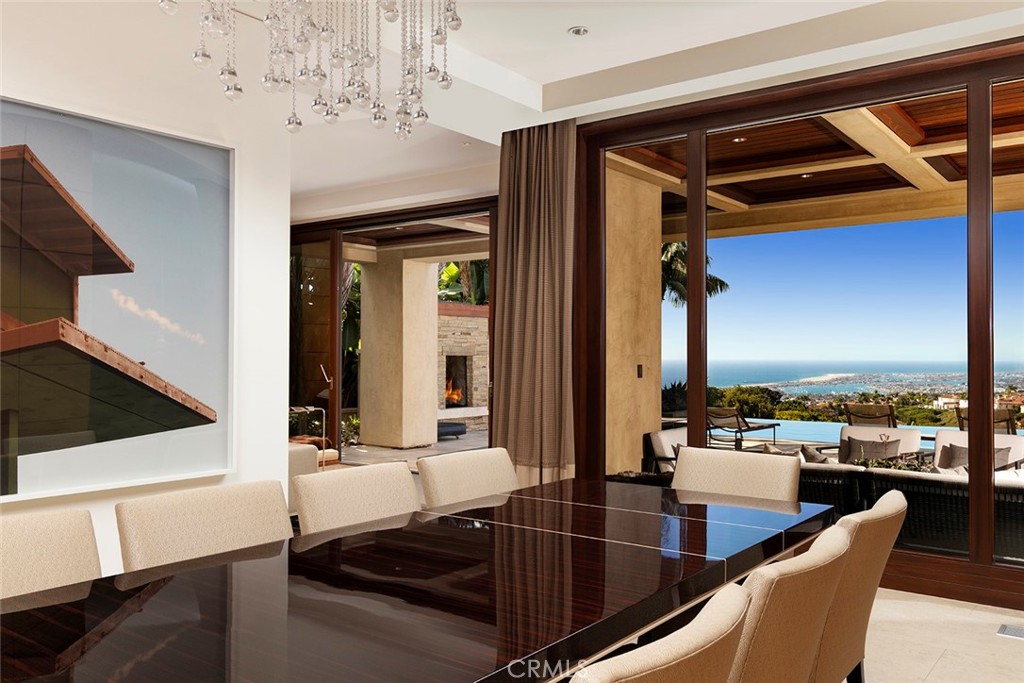 9 Sailcrest Newport Coast, CA 92657 - Photo 5 of 37 a kitchen with stainless steel appliances granite countertop a sink and cabinets