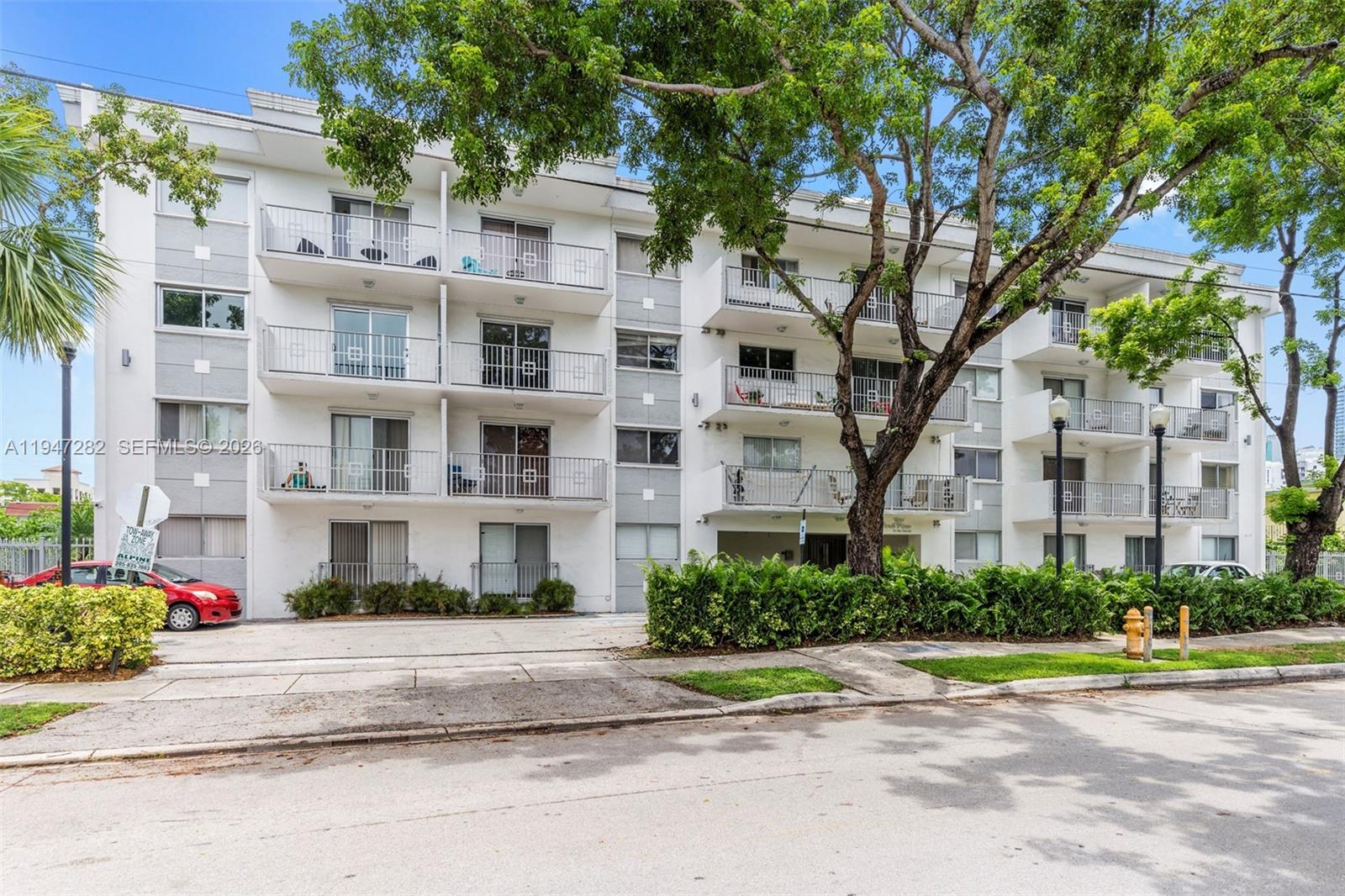 445 Southwest 11th Street, Unit 404 Miami, FL 33130 - Photo 1 of 13 a view of building with street view