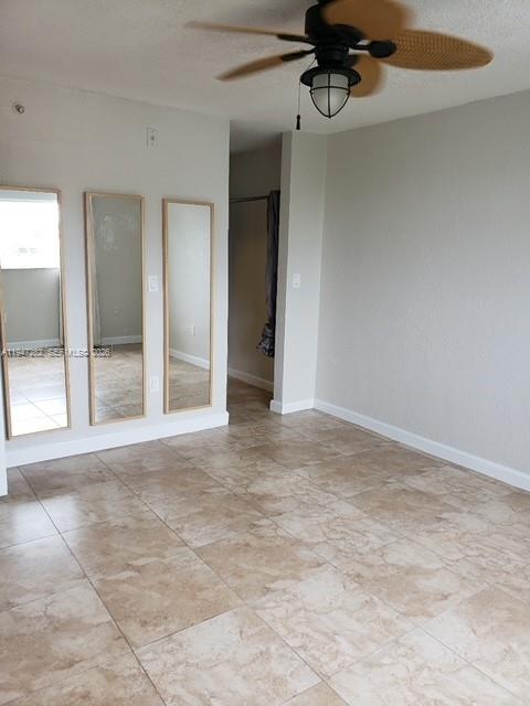 445 Southwest 11th Street, Unit 404 Miami, FL 33130 - Photo 6 of 13 a view of an empty room with a window