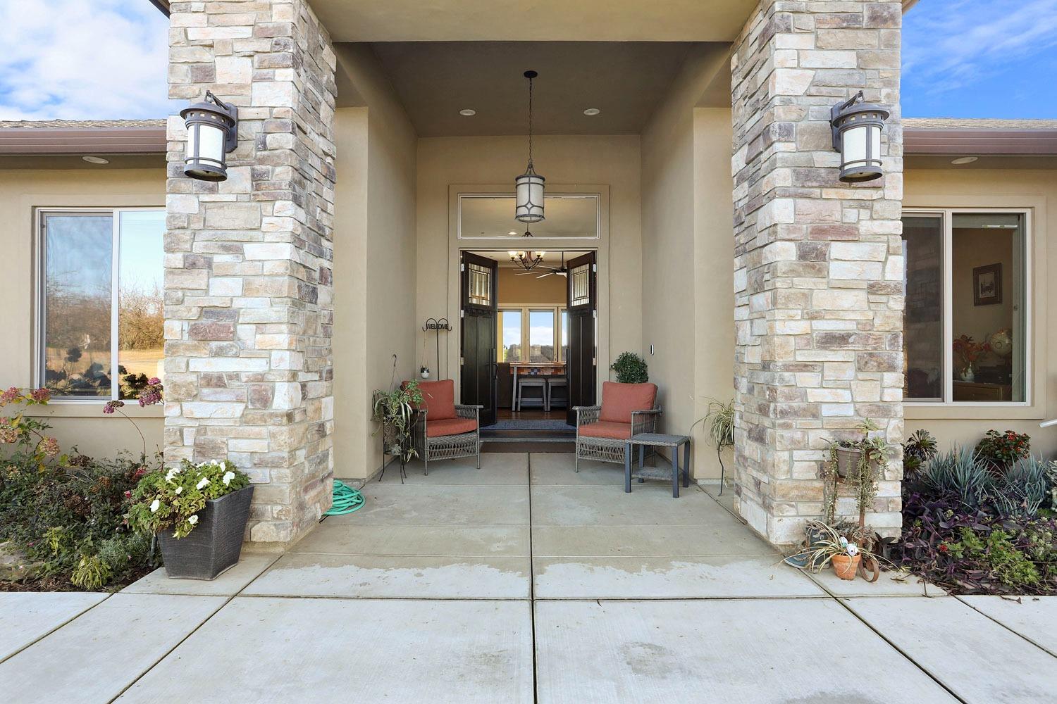 10393 Bradbury Road Ballico, CA 95303 - Photo 13 of 85 a view of a lobby with chair and flower plants