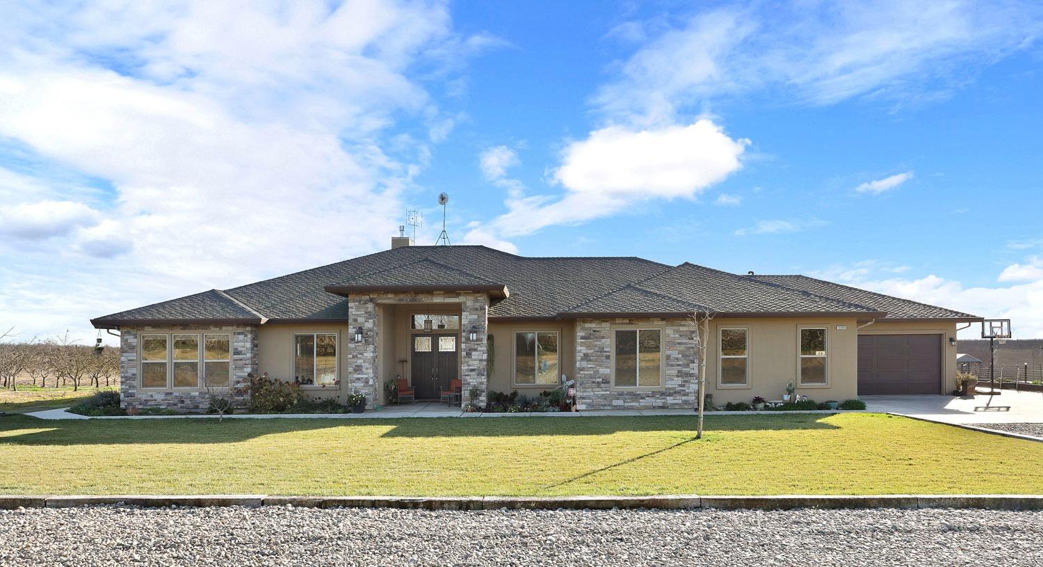 10393 Bradbury Road Ballico, CA 95303 - Photo 8 of 85 a front view of a house with swimming pool having outdoor seating