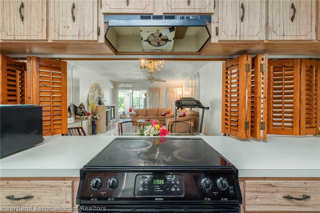 4722 Granada Boulevard Sebring, FL 33872 - Photo 2 of 11 a kitchen with a stove and cabinets