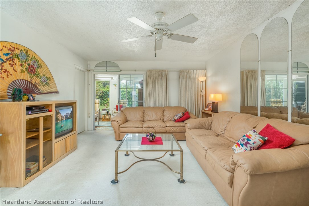 4722 Granada Boulevard Sebring, FL 33872 - Photo 5 of 11 a living room with furniture and white walls