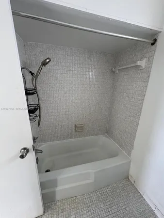 a bathroom with a bath tub