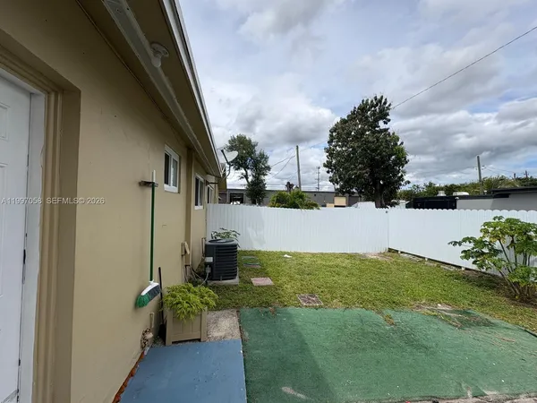 a view of a patio with garden
