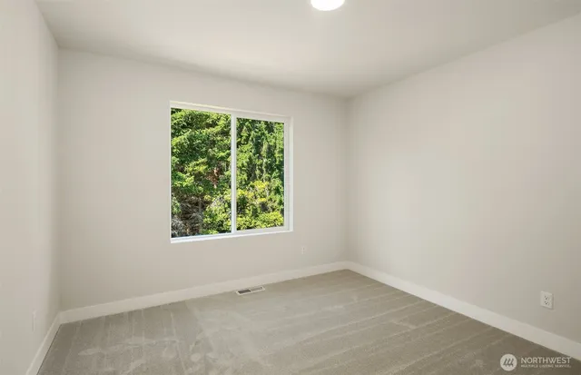 a view of house with backyard