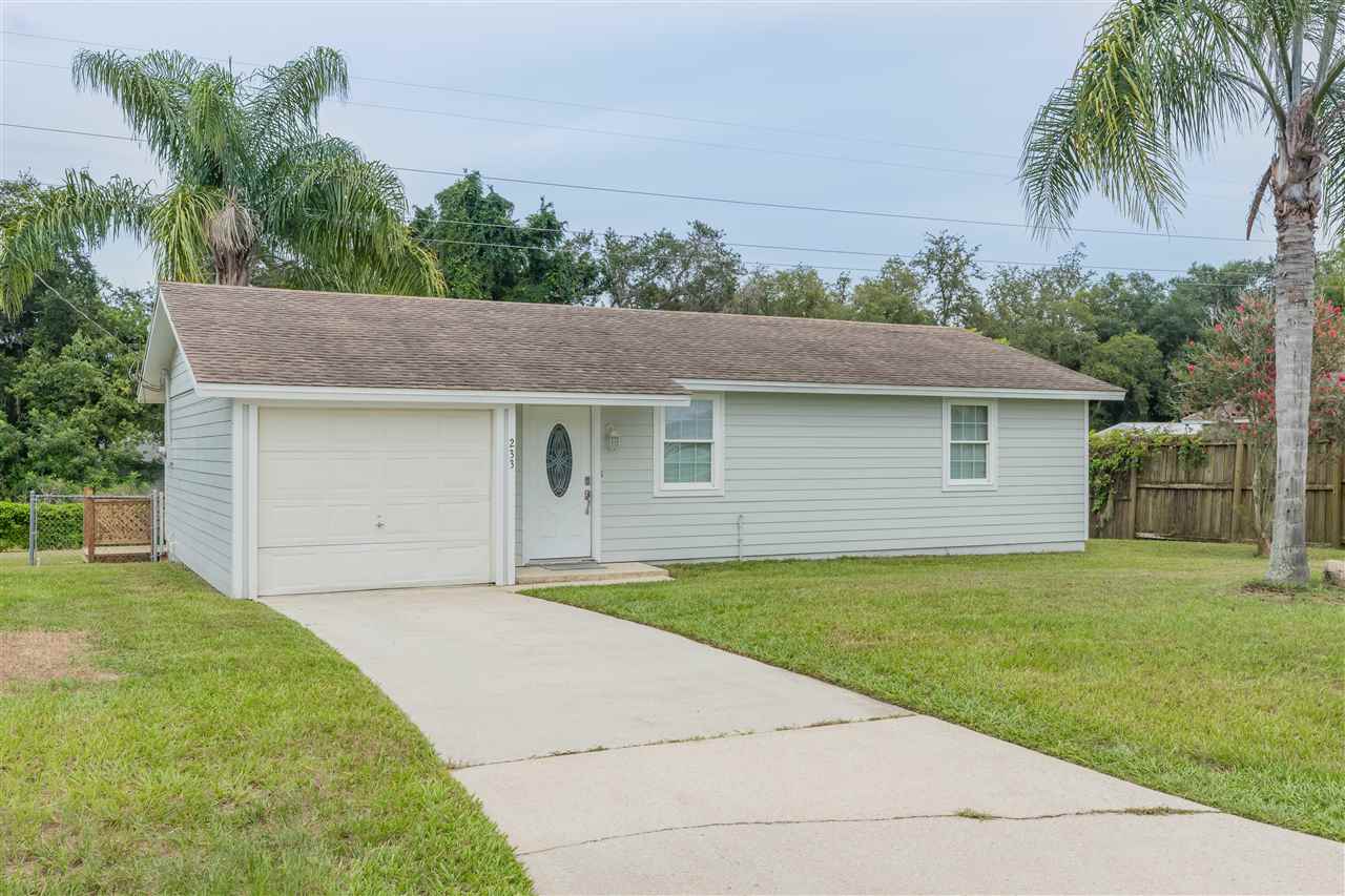 233 Cornell Road St. Augustine, FL 32086 - Photo 2 of 35 a front view of a house with a garden