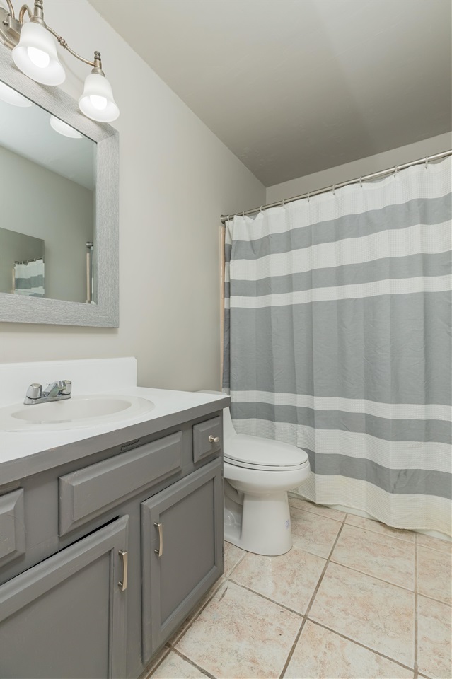 233 Cornell Road St. Augustine, FL 32086 - Photo 14 of 35 a bathroom with a sink a toilet and a mirror