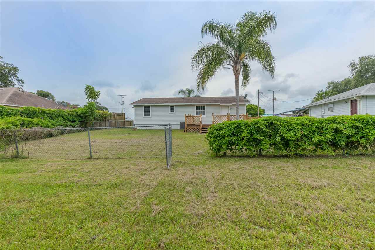 233 Cornell Road St. Augustine, FL 32086 - Photo 18 of 35 a house with a garden and a yard