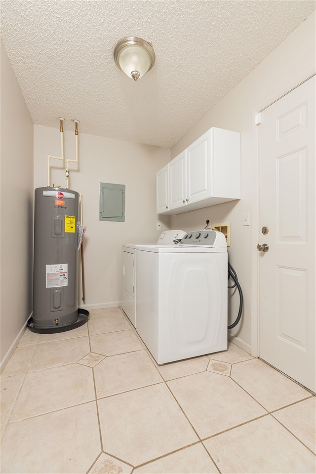 233 Cornell Road St. Augustine, FL 32086 - Photo 20 of 35 a utility room with cabinets washer and dryer