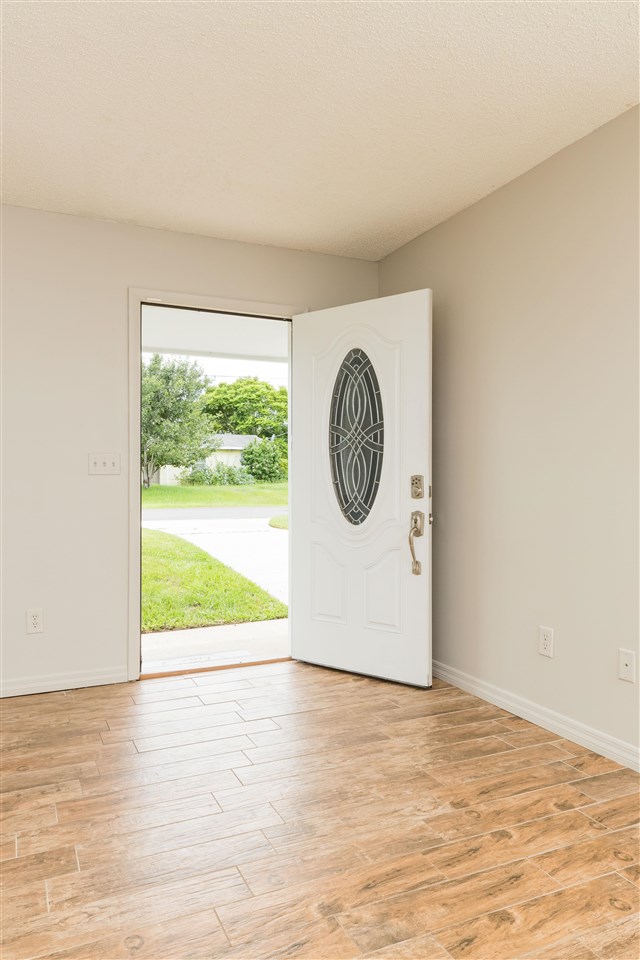 233 Cornell Road St. Augustine, FL 32086 - Photo 3 of 35 a view of a room with wooden floor and a window