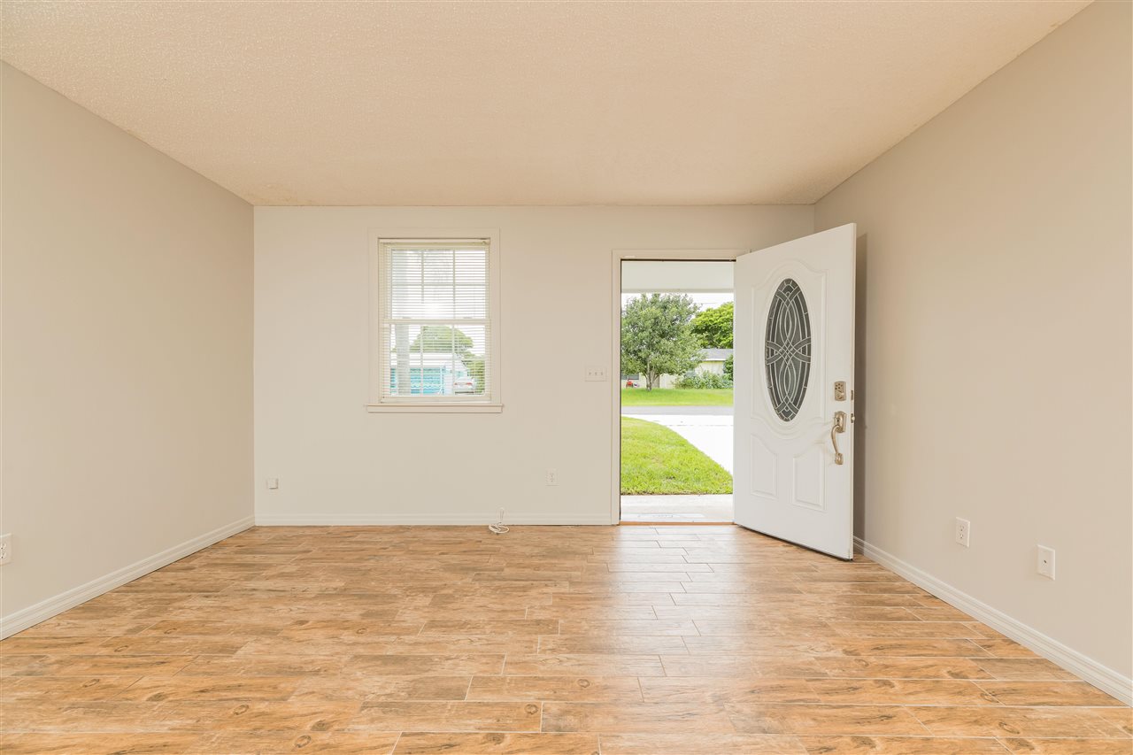 233 Cornell Road St. Augustine, FL 32086 - Photo 4 of 35 a view of a room with wooden floor and windows