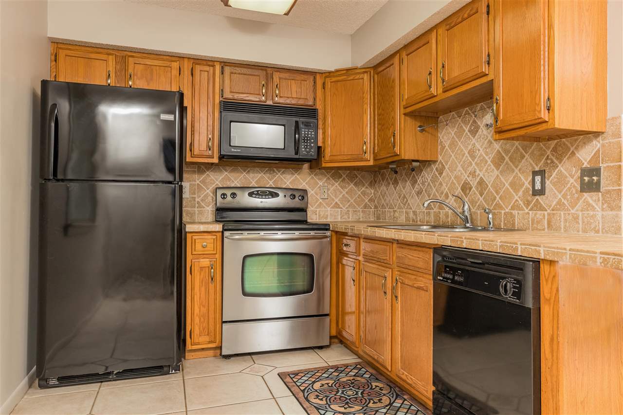 233 Cornell Road St. Augustine, FL 32086 - Photo 9 of 35 a kitchen with a refrigerator sink and cabinets