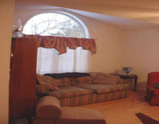 1138 Reed Street Warren, MA 01092 - Photo 3 of 7 a bed sitting in a bedroom next to a lamp