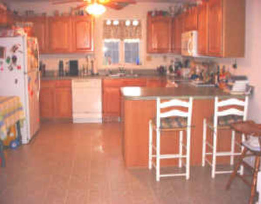 1138 Reed Street Warren, MA 01092 - Photo 5 of 7 a view of a kitchen with a sink and cabinets