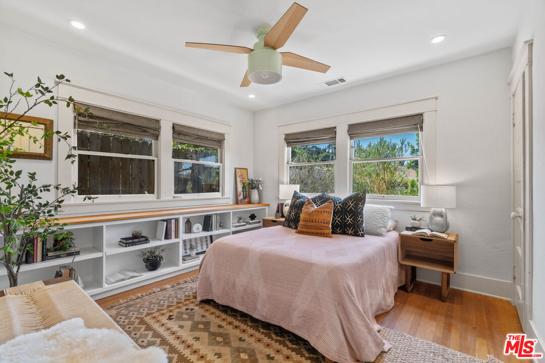6157 Springvale Drive Los Angeles, CA 90042 - Photo 12 of 21 a bedroom with furniture and a large window