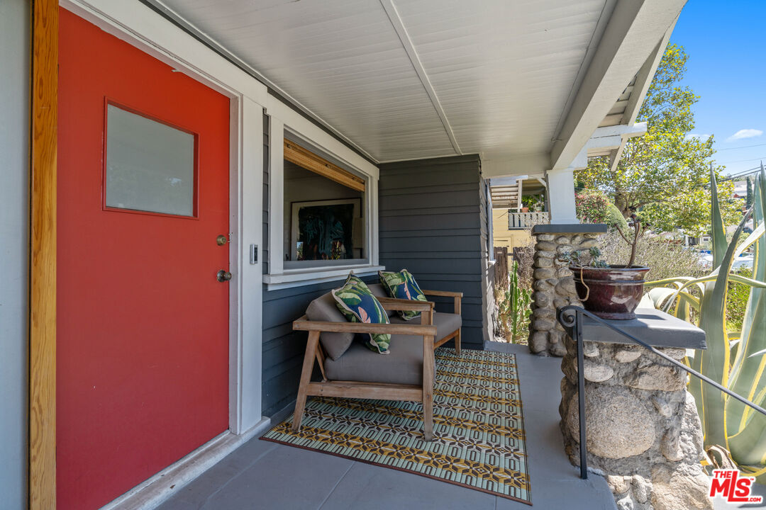6157 Springvale Drive Los Angeles, CA 90042 - Photo 3 of 21 a living room with furniture and a fireplace