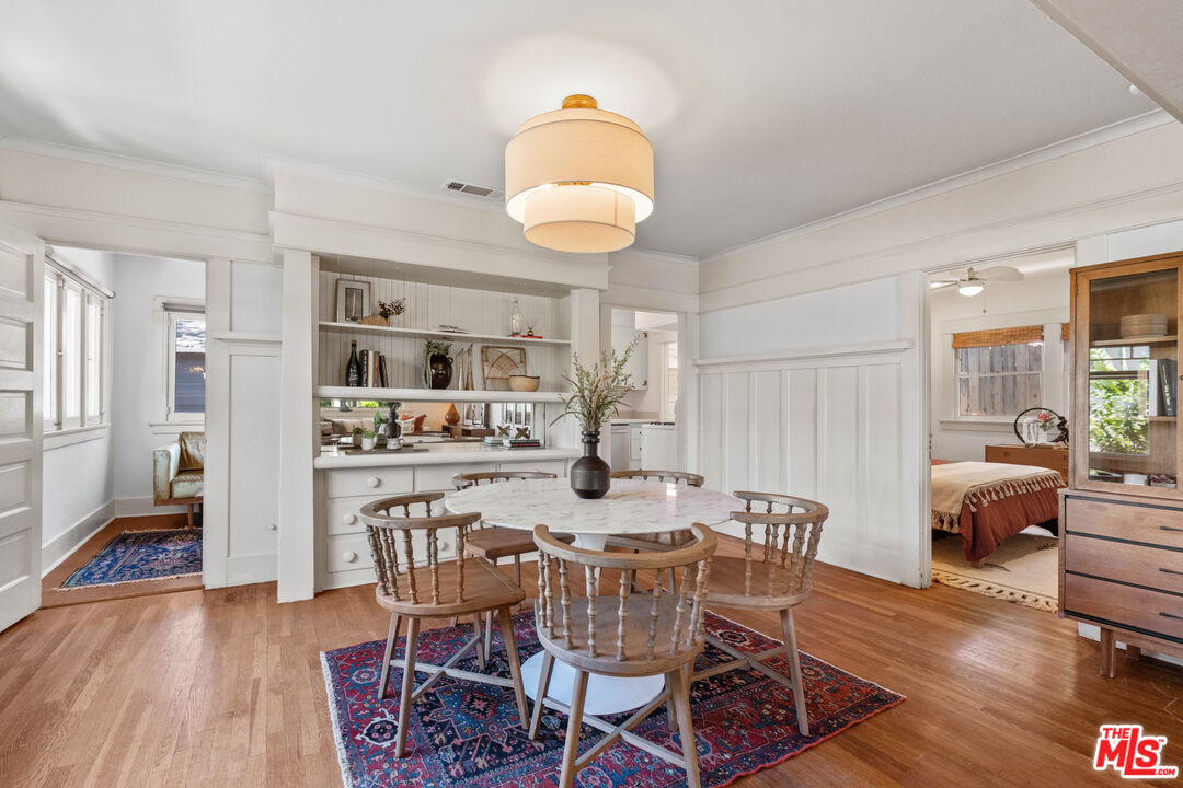 6157 Springvale Drive Los Angeles, CA 90042 - Photo 5 of 21 a view of a dining room with furniture and wooden floor