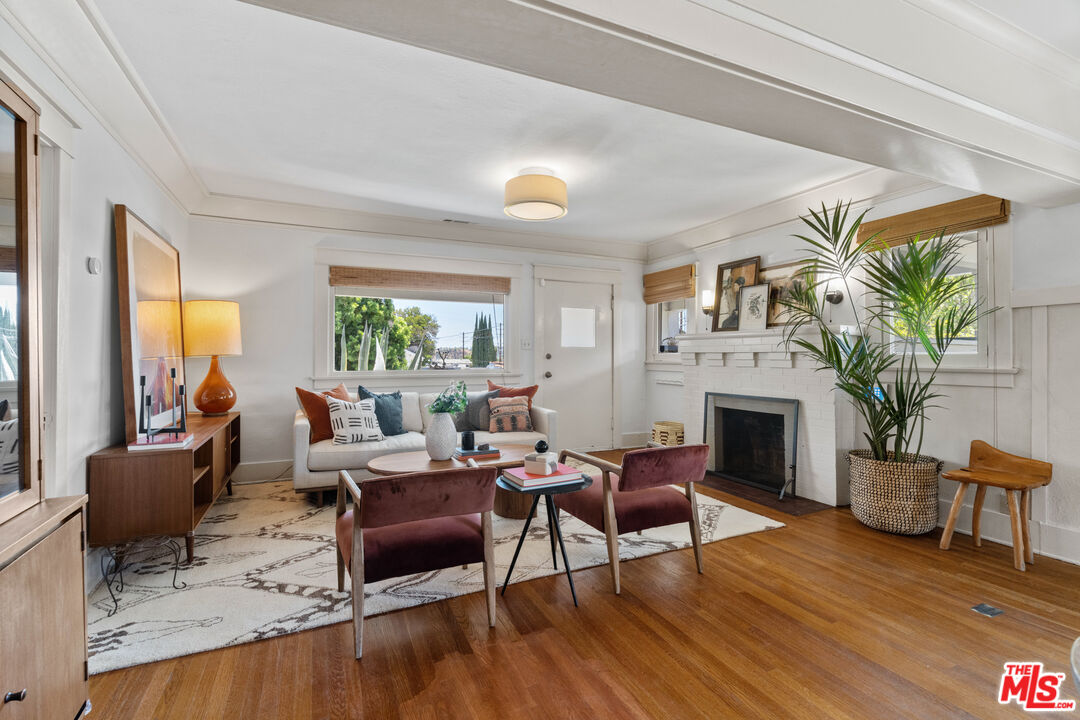 6157 Springvale Drive Los Angeles, CA 90042 - Photo 8 of 21 a living room with furniture fireplace and potted plants