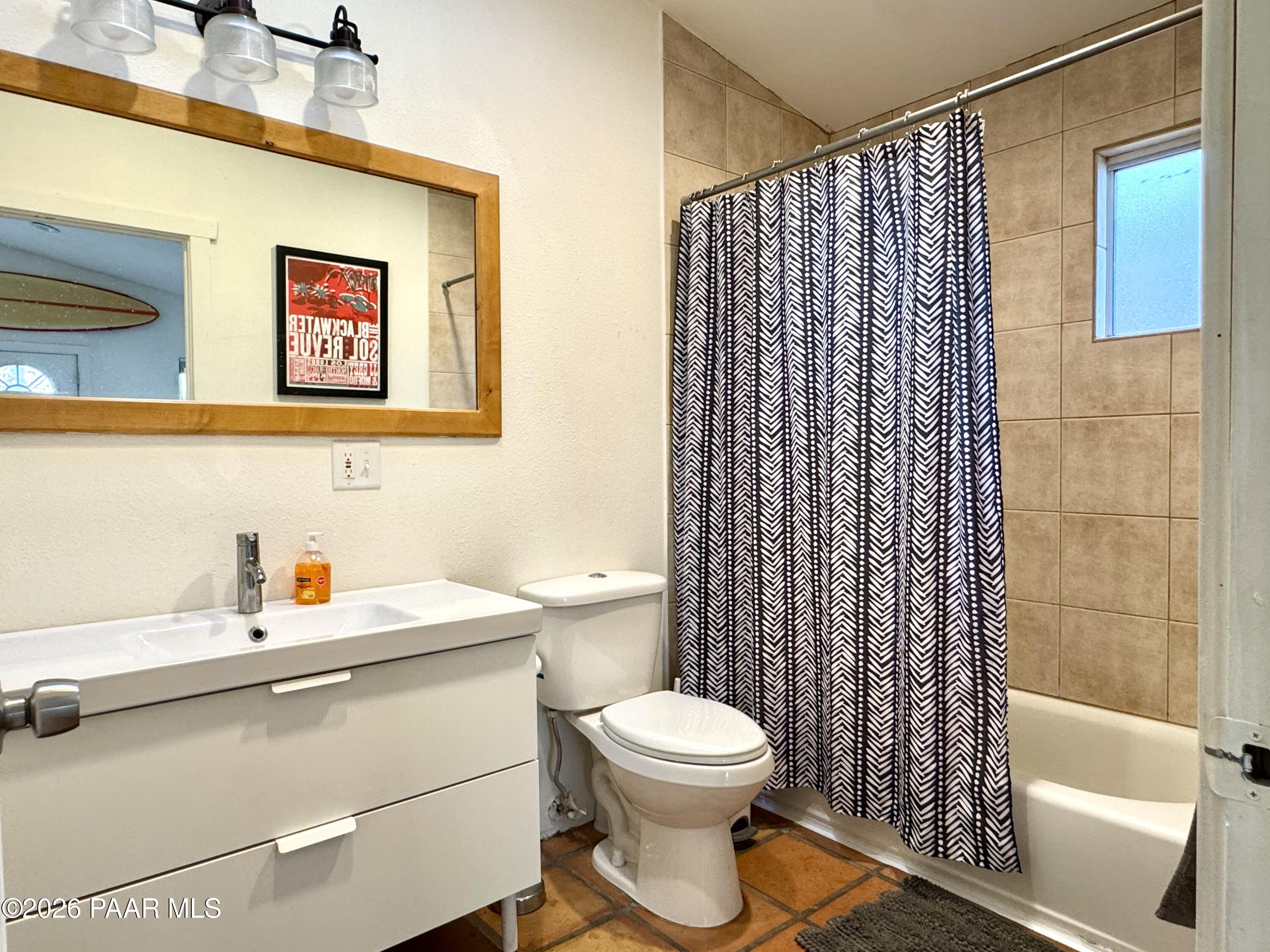 815 Ruth Street Prescott, AZ 86301 - Photo 28 of 30 a bathroom with a sink a toilet and shower curtain