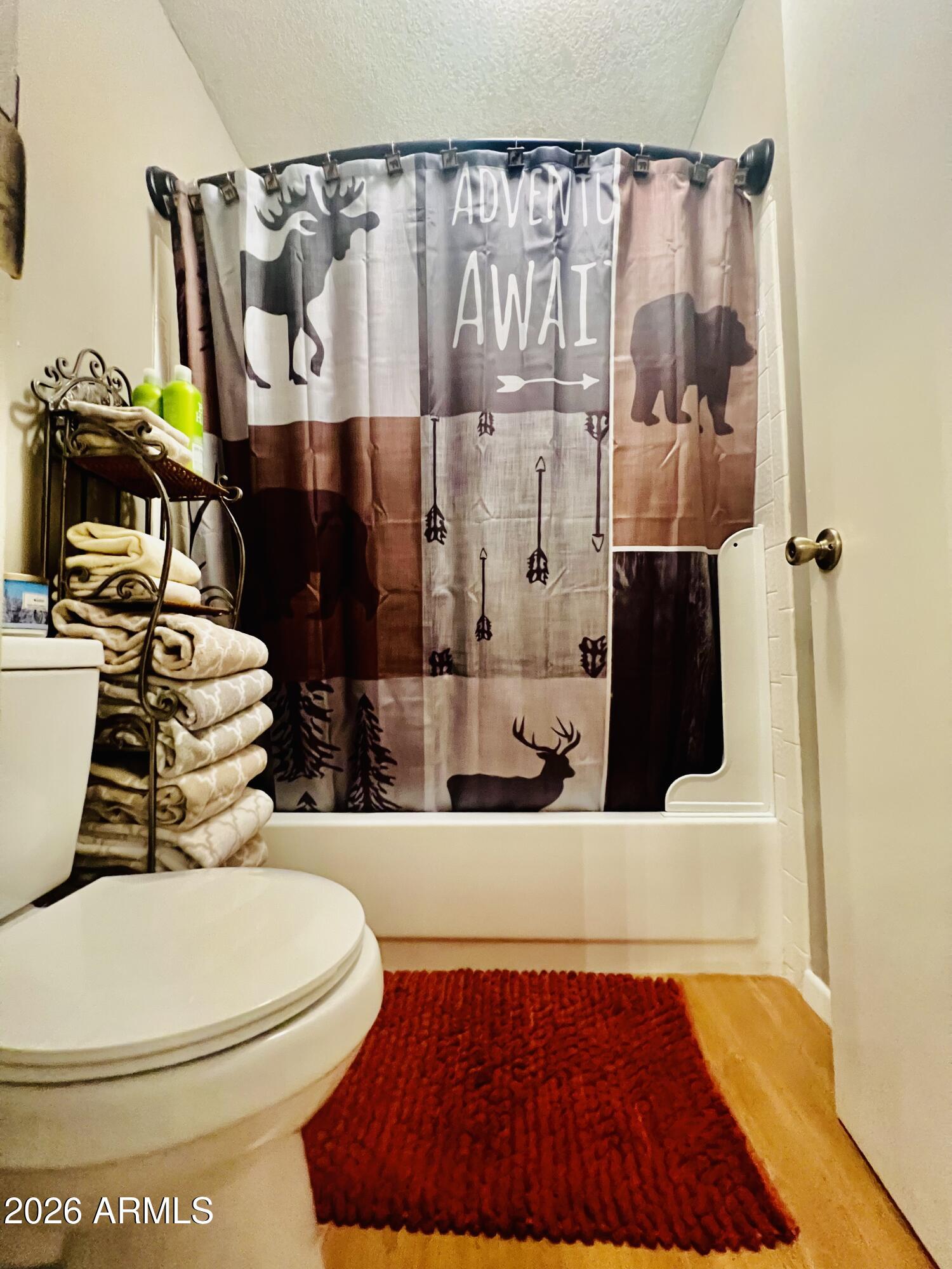 2700 South White Mountain Road, Unit 1126 Show Low, AZ 85901 - Photo 17 of 32 a bathroom with a toilet and a sink