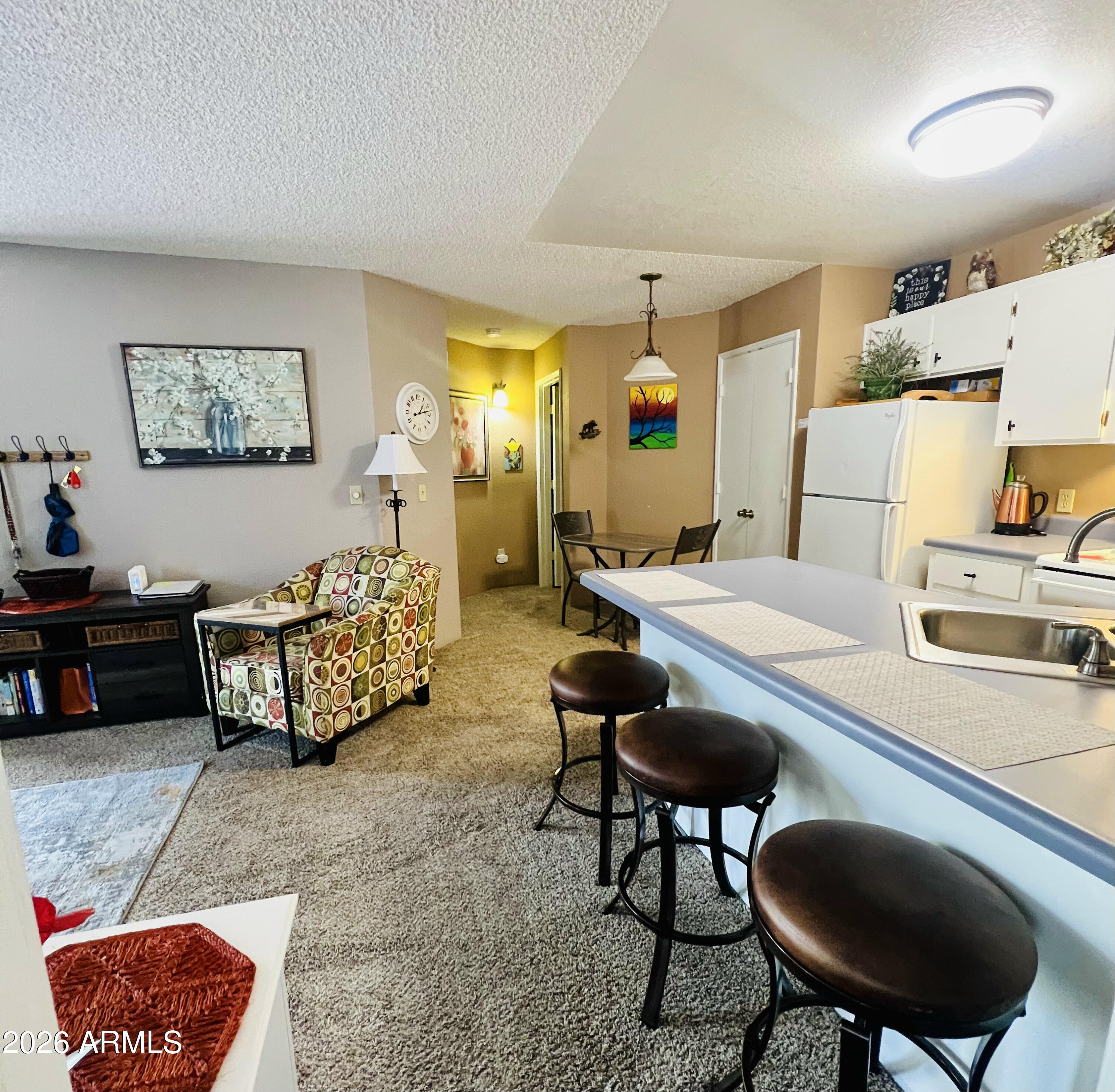 2700 South White Mountain Road, Unit 1126 Show Low, AZ 85901 - Photo 10 of 32 a living room with furniture and a table