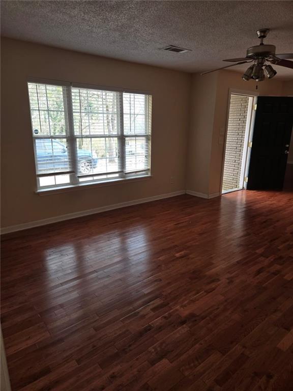 3704 Bolding Road Flowery Branch, GA 30542 - Photo 2 of 10 wooden floor in an empty room with a window