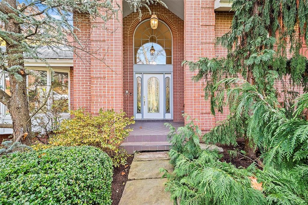 801 Elm Spring Road Pittsburgh, PA 15243 - Photo 2 of 25 a front view of a house with a garden