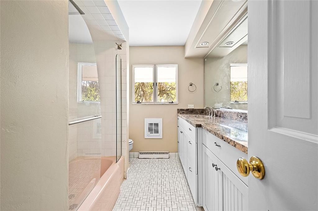 801 Elm Spring Road Pittsburgh, PA 15243 - Photo 17 of 25 a bathroom with a granite countertop sink a toilet and a bathtub