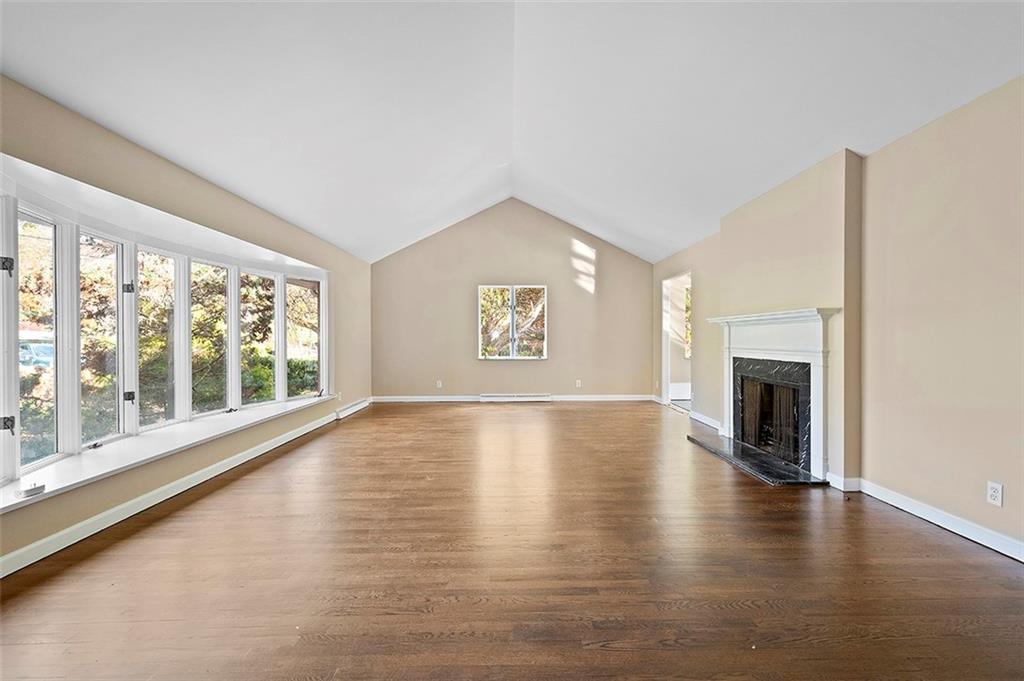801 Elm Spring Road Pittsburgh, PA 15243 - Photo 4 of 25 a view of an empty room with a window and fireplace