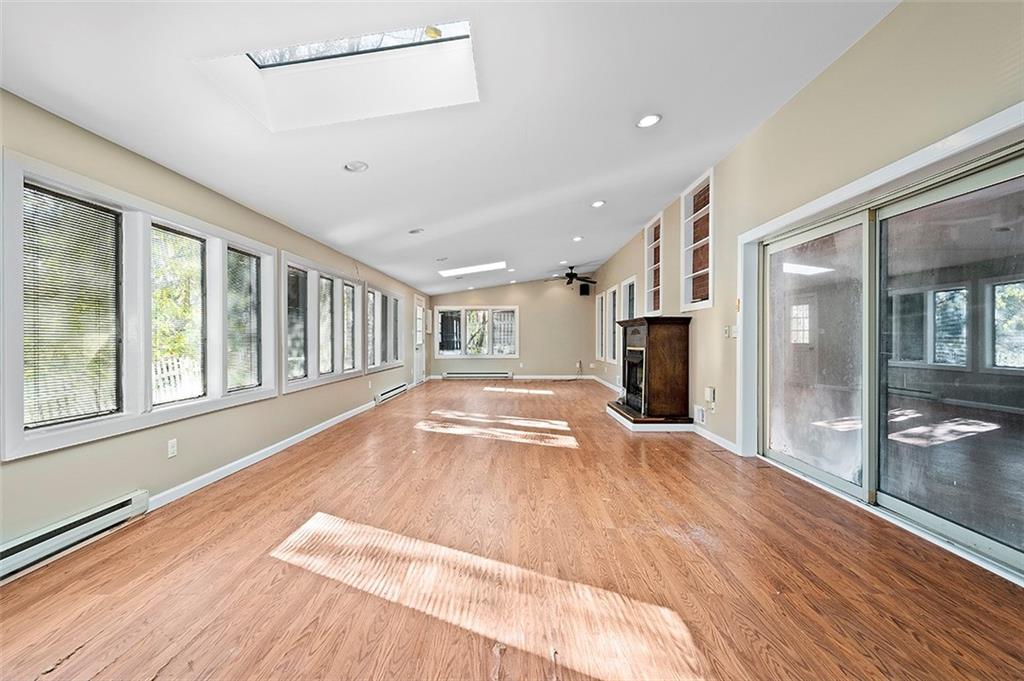 801 Elm Spring Road Pittsburgh, PA 15243 - Photo 10 of 25 a view of an empty room with wooden floor and a window