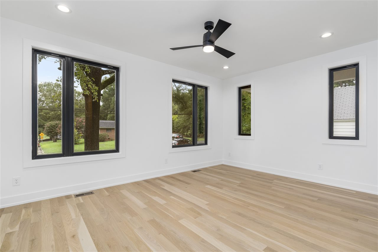 1600 Glendale Avenue Durham, NC 27701 - Photo 11 of 29 a view of an empty room with a window and wooden floor