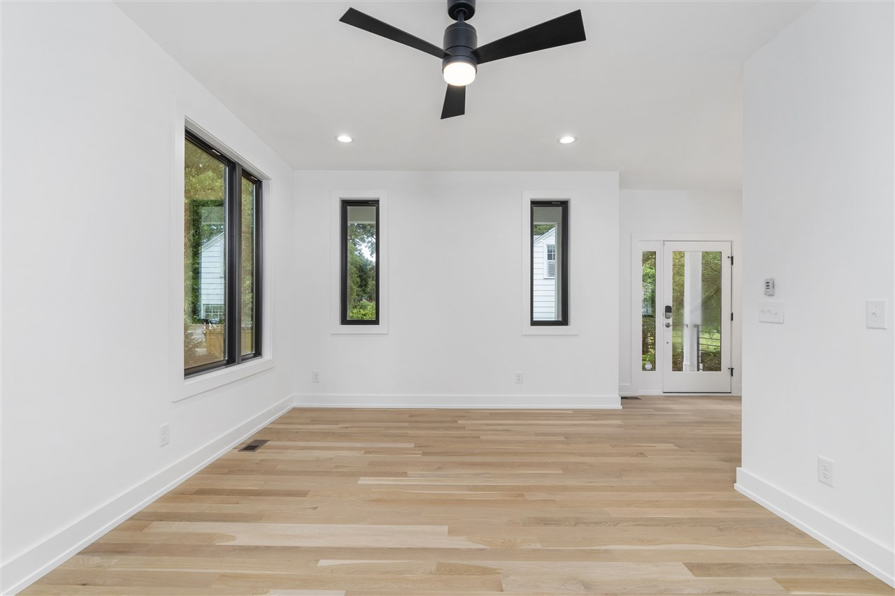 1600 Glendale Avenue Durham, NC 27701 - Photo 12 of 29 a view of an empty room with wooden floor and a window