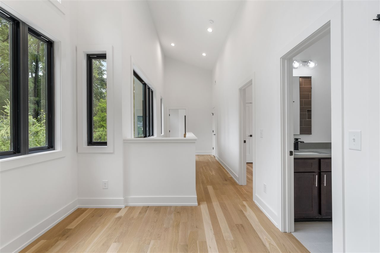 1600 Glendale Avenue Durham, NC 27701 - Photo 16 of 29 a view of a hallway with wooden floor and staircase