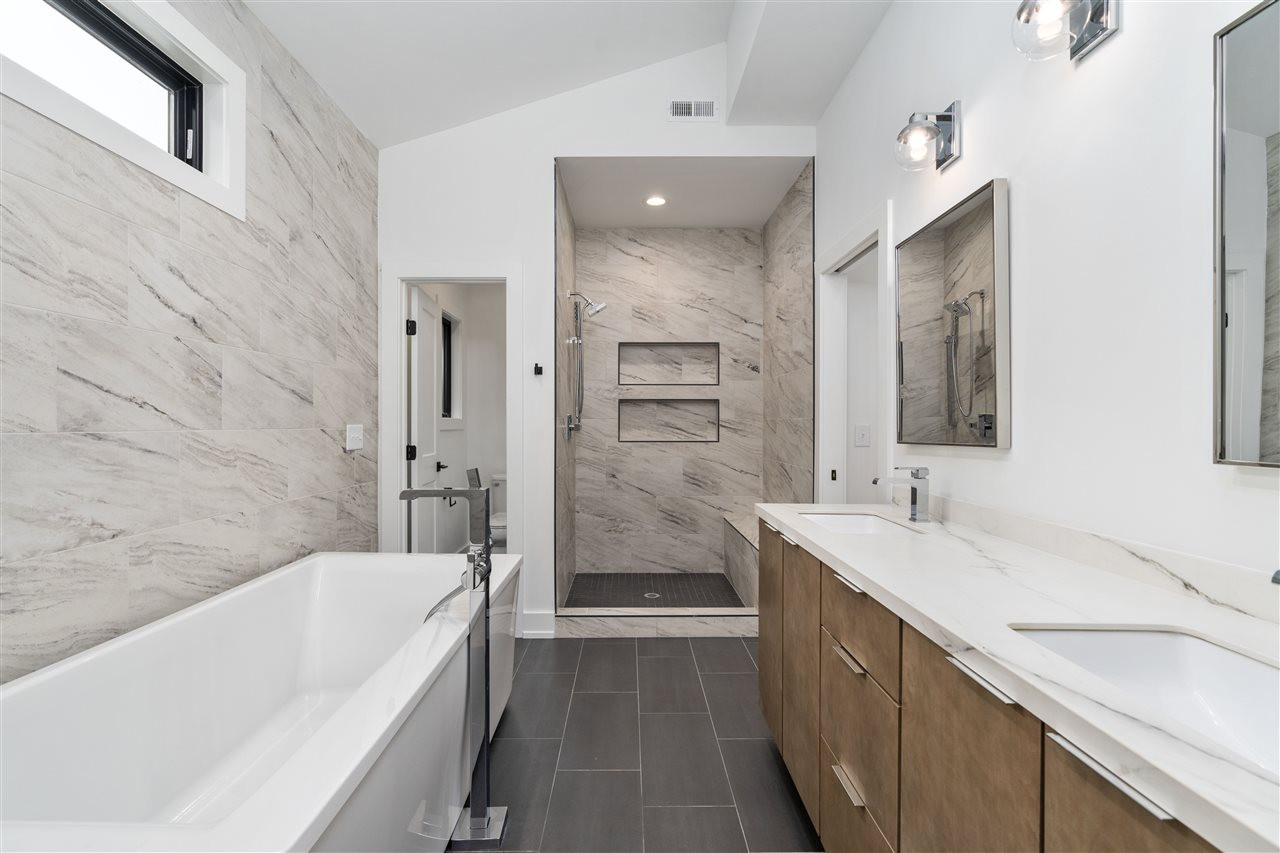 1600 Glendale Avenue Durham, NC 27701 - Photo 20 of 29 a bathroom with a bathtub shower and a sink
