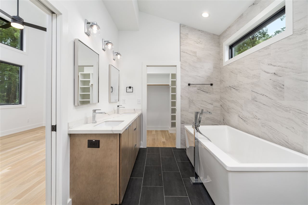 1600 Glendale Avenue Durham, NC 27701 - Photo 21 of 29 a bathroom with a sink a toilet and shower