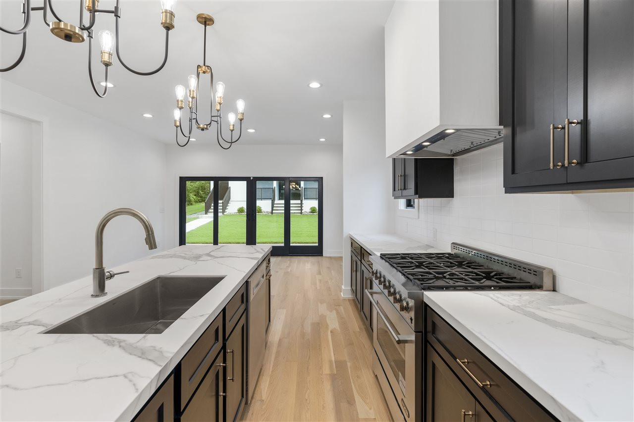 1600 Glendale Avenue Durham, NC 27701 - Photo 4 of 29 a kitchen that has a lot of cabinets and wooden floor