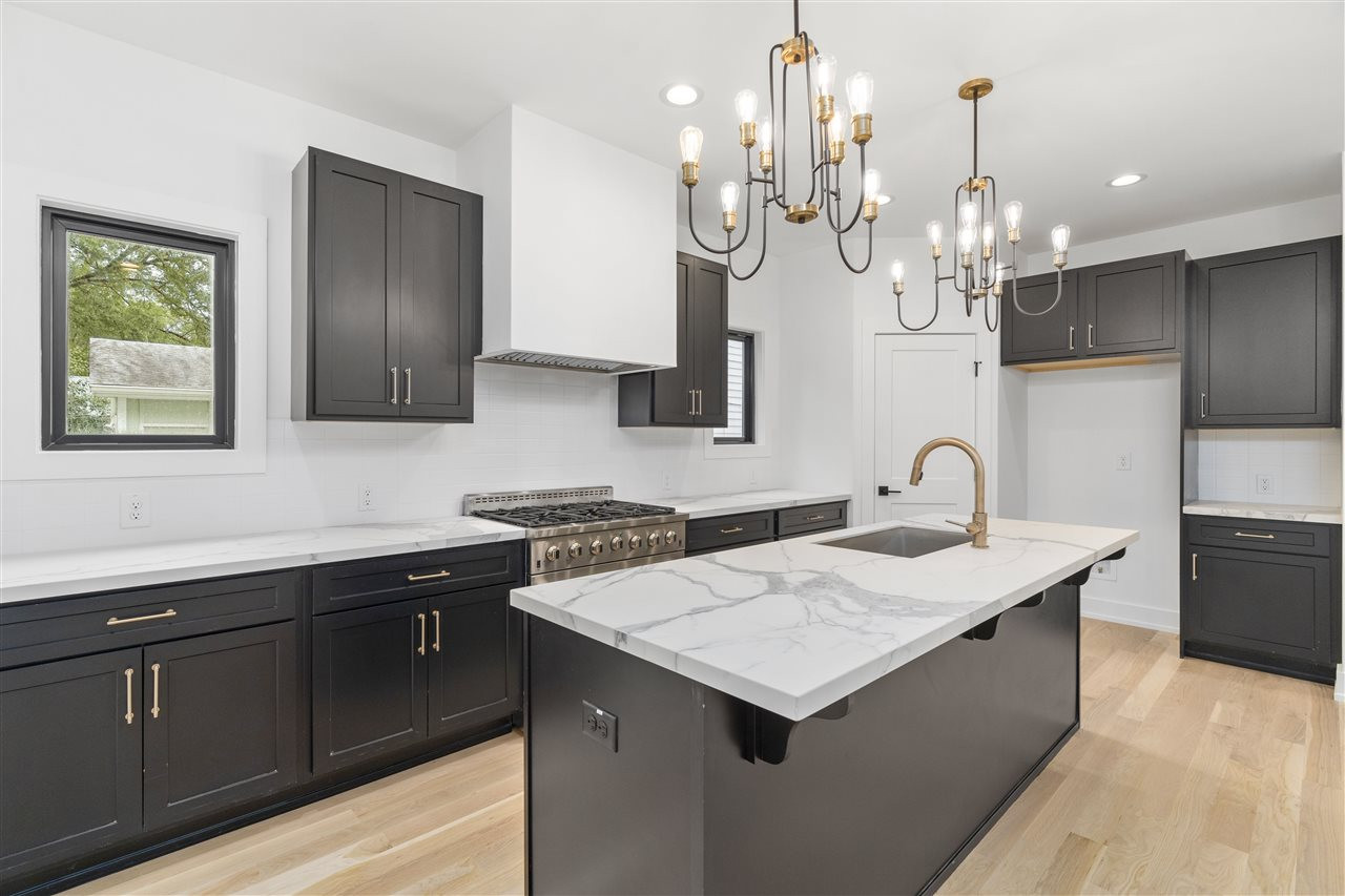 1600 Glendale Avenue Durham, NC 27701 - Photo 6 of 29 a kitchen with a sink and cabinets
