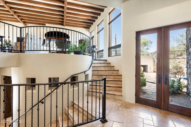 a bedroom with bed and wooden cabinets