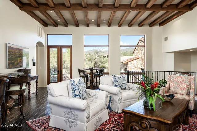 a living room with furniture and a lamp
