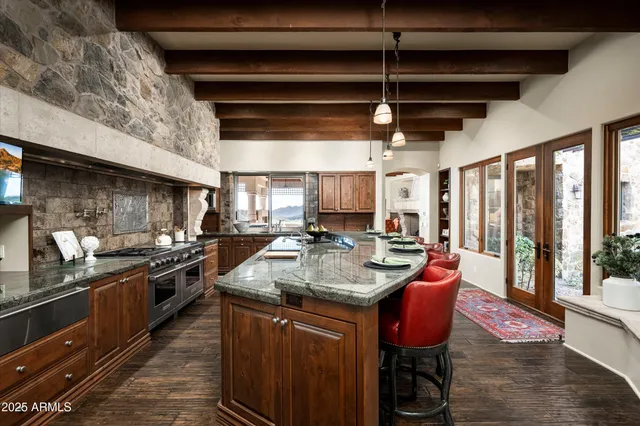 a bathroom with a double vanity sink and a toilet